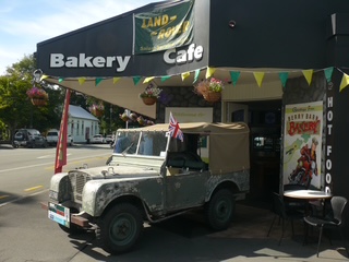 Side view of the 1948 Land Rover beside the Berry Barn