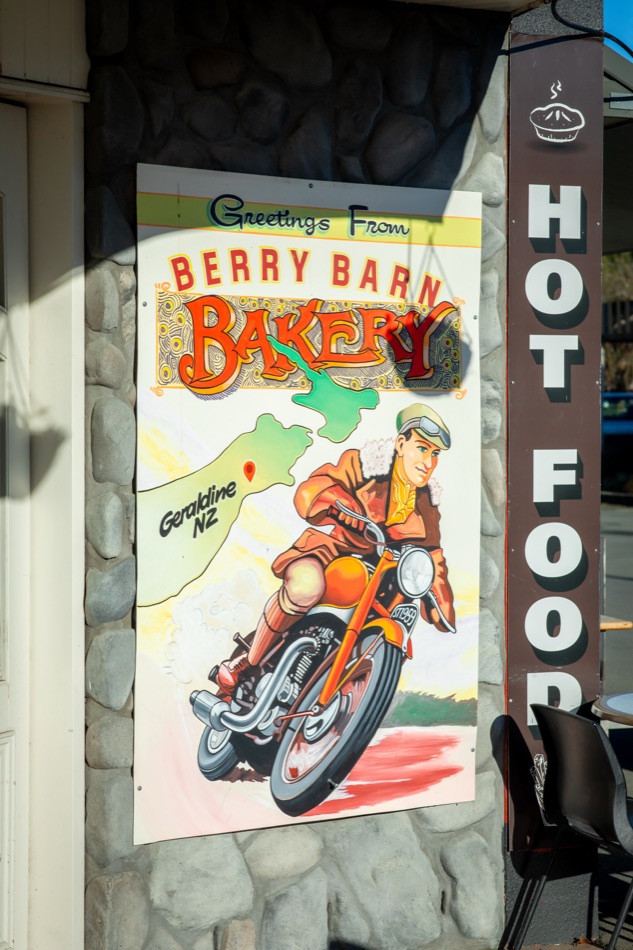 The Greetings from Berry Barn Bakery motorcycle poster on the outside wall